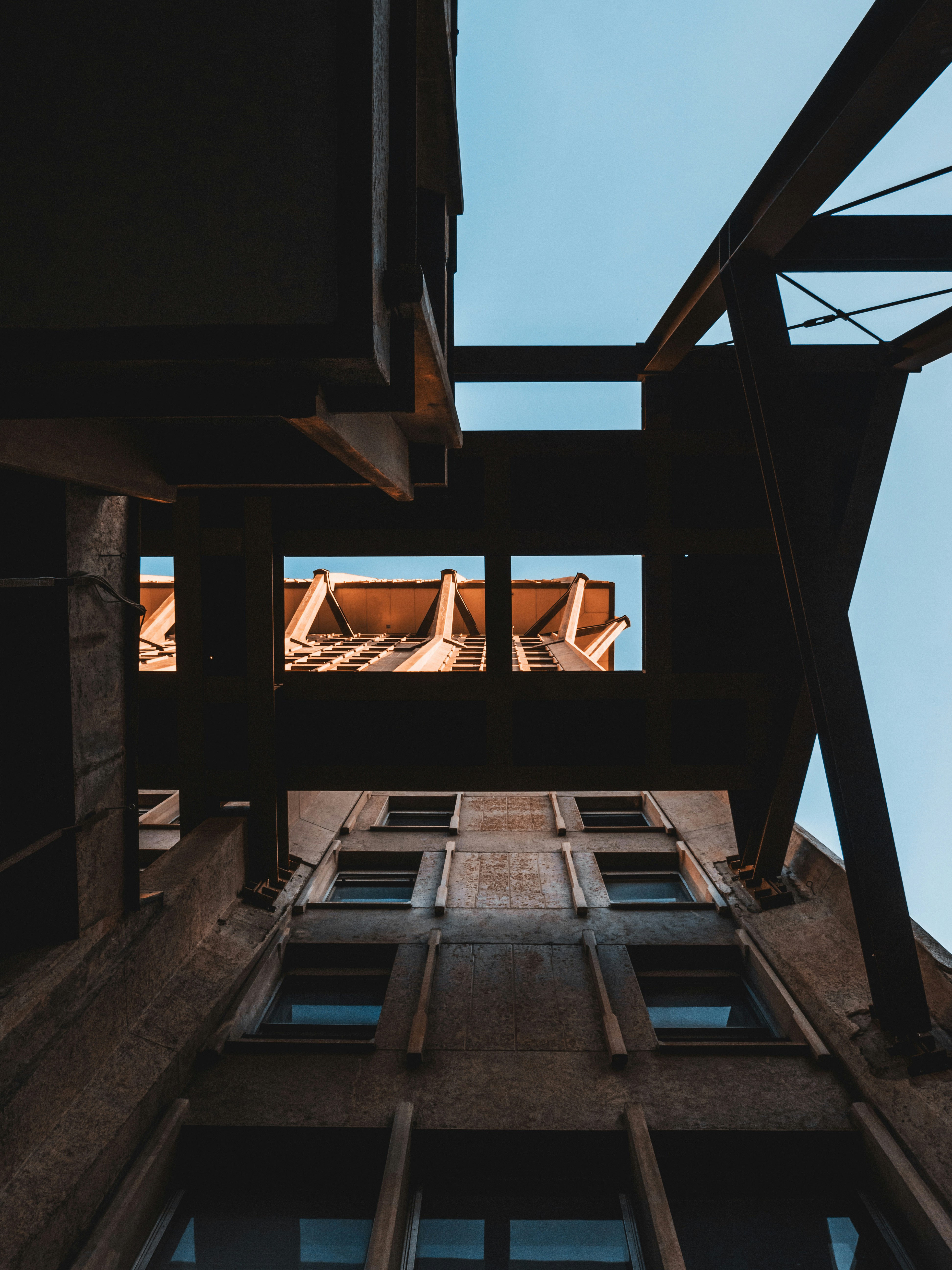 low angle photography of brown wooden stairs