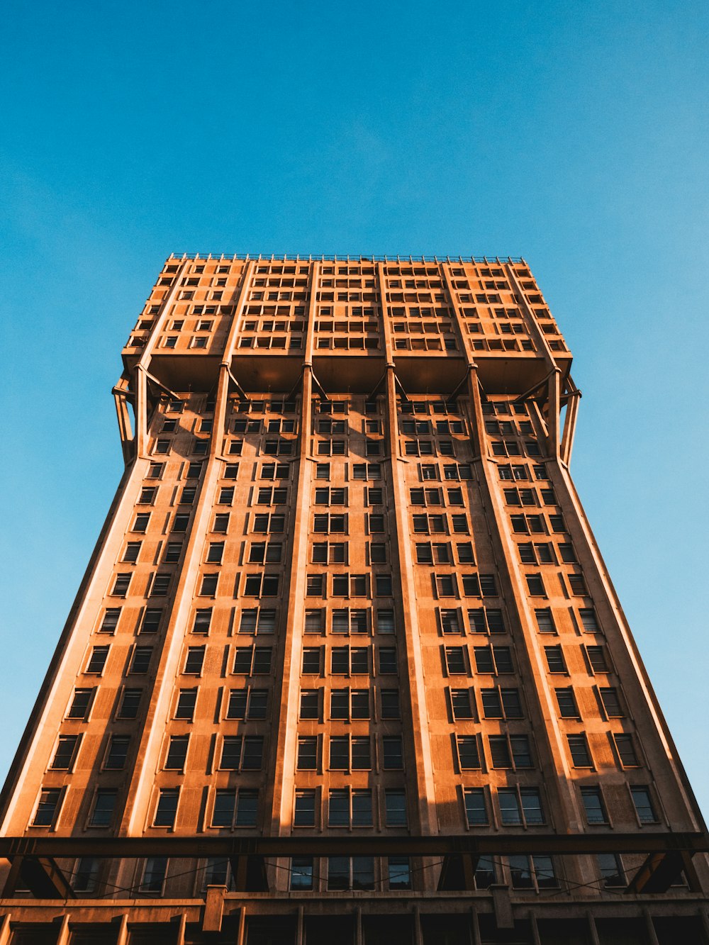 brown concrete building under blue sky during daytime