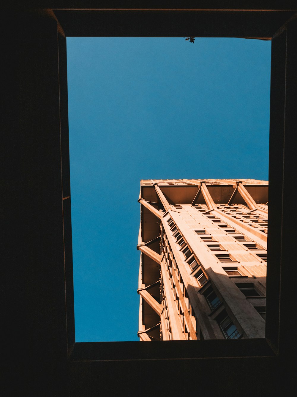 brown wooden frame under blue sky during daytime