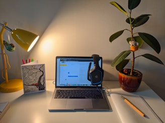 macbook pro on white table