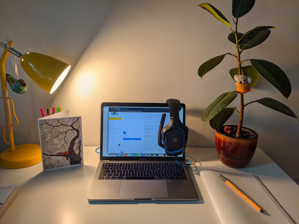 macbook pro on white table