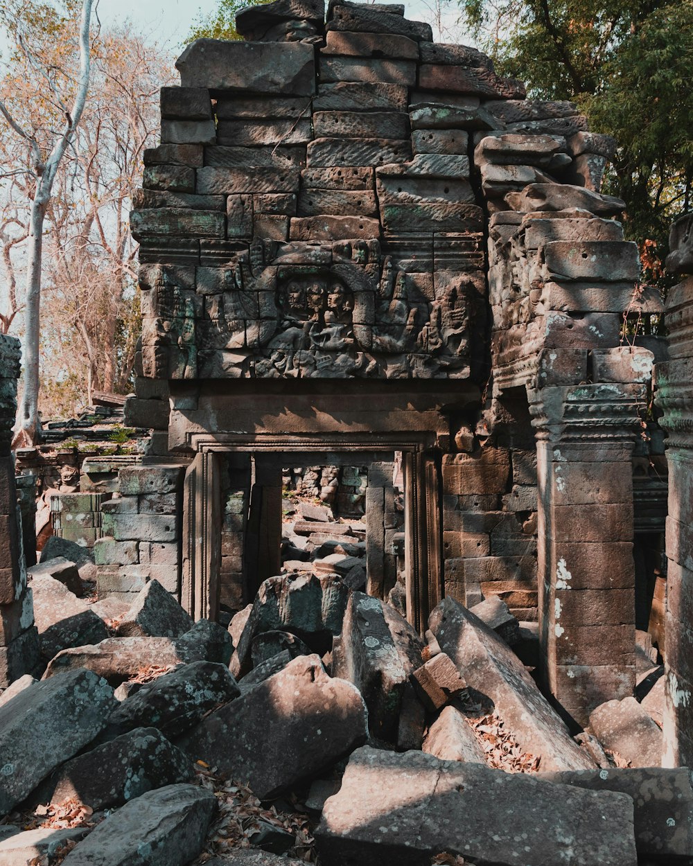 brown concrete ruins near trees during daytime