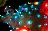 A close-up of a colorful sculpture in a bright room.