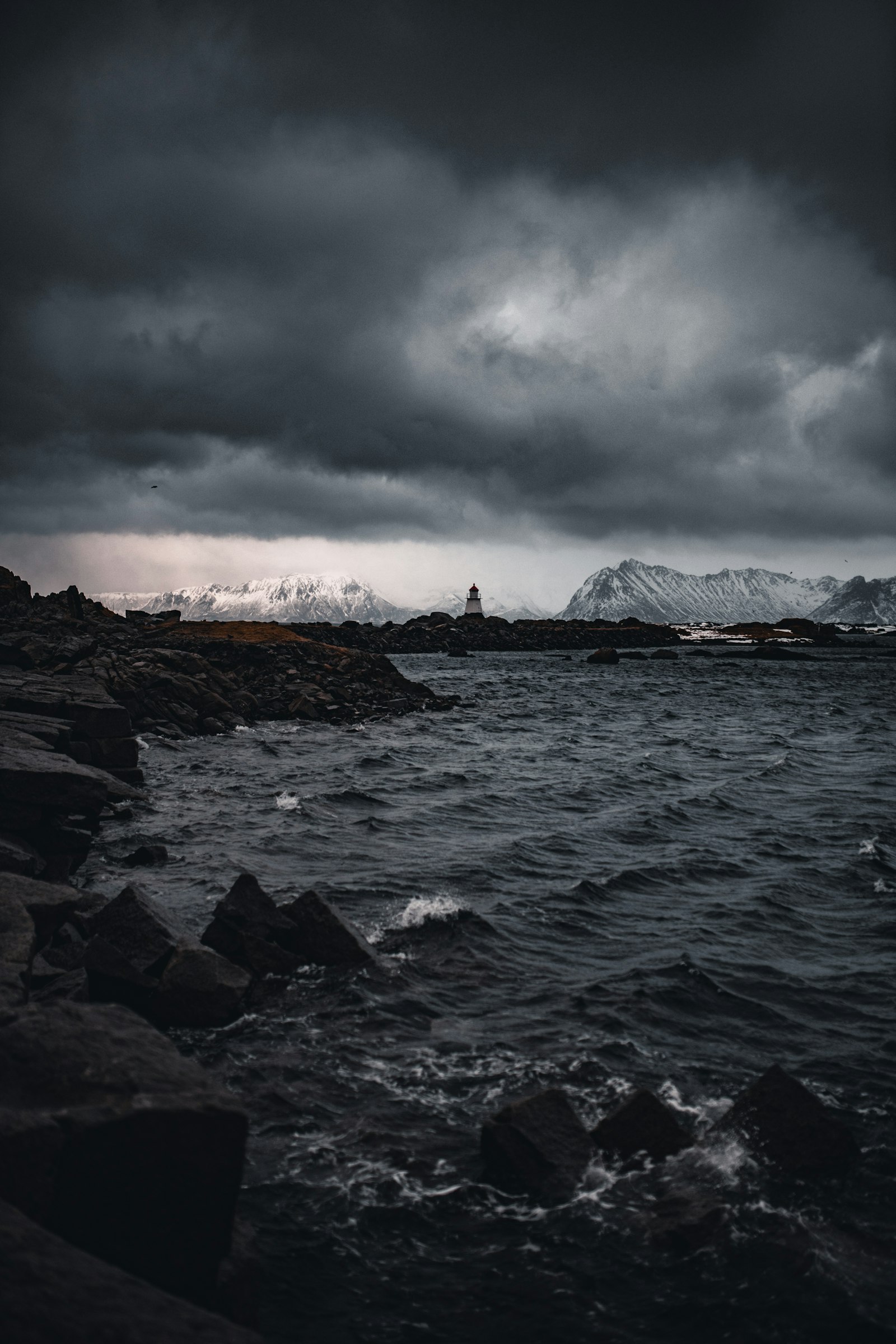 Nikon D850 + Sigma 35mm F1.4 DG HSM Art sample photo. Rocky shore with mountain photography