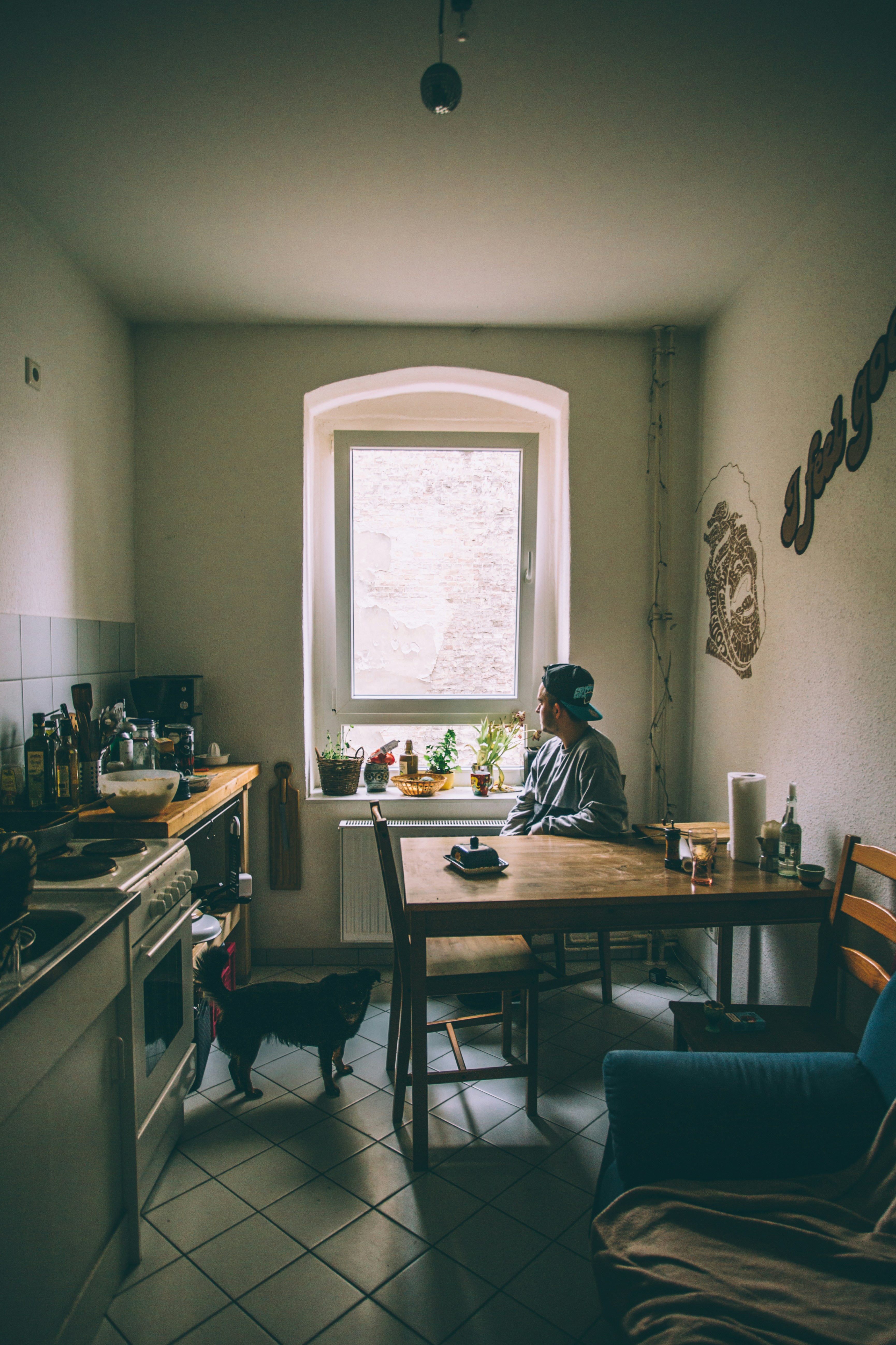 2 women sitting on chair in front of table