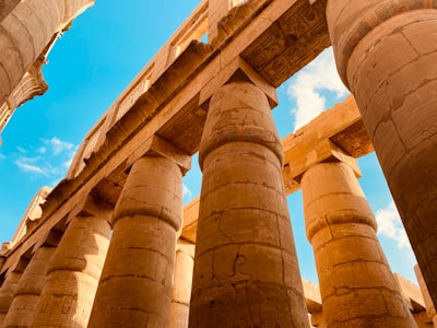 brown concrete pillars under blue sky during daytime egypt google meet background