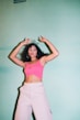 woman in pink tank top and white shorts