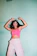 woman in pink tank top and white shorts