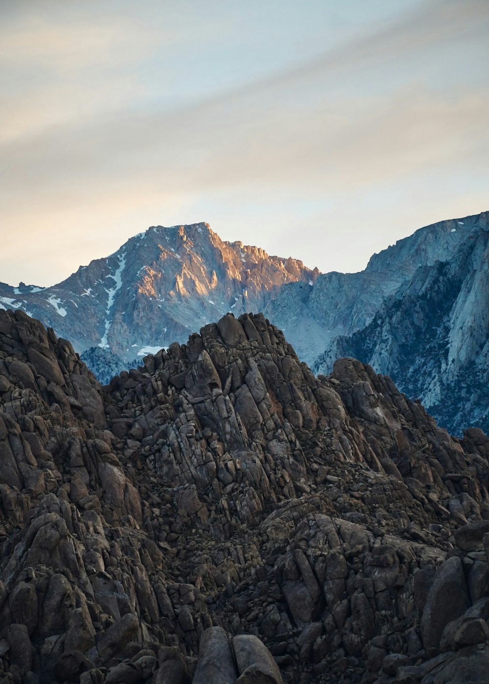 brown rocky mountain under white cloudy sky during daytime