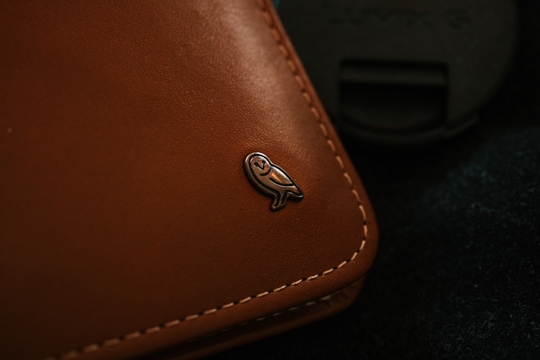 brown leather textile with silver heart emblem