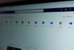 A computer screen displays a webpage featuring a row of icons for various applications such as OneNote, SharePoint, Teams, Sway, and Yammer. The phrase 'Office installieren' is visible on the right side of the screen.