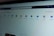 A computer screen displays a webpage featuring a row of icons for various applications such as OneNote, SharePoint, Teams, Sway, and Yammer. The phrase 'Office installieren' is visible on the right side of the screen.