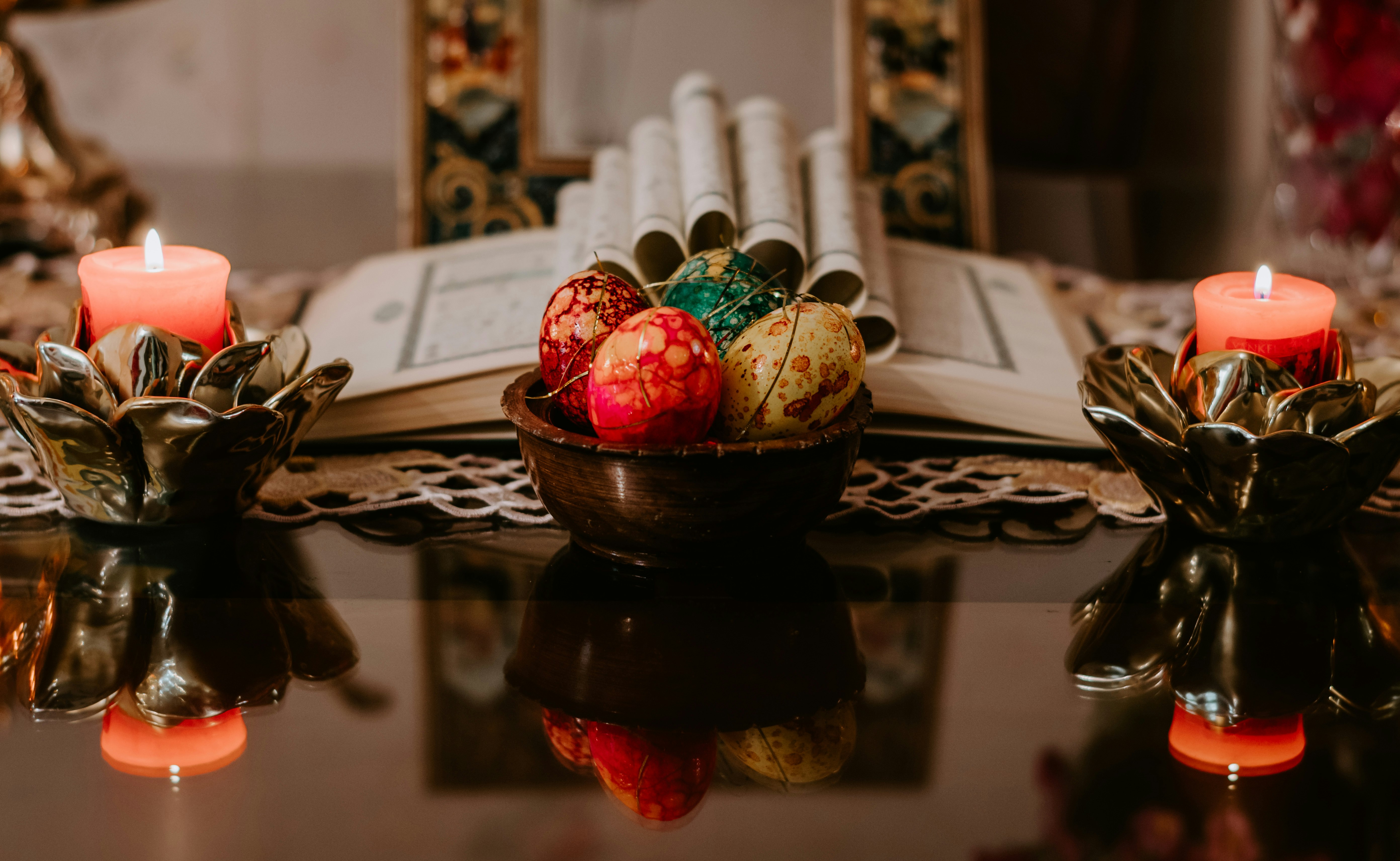 red and green fruit on brown ceramic bowl