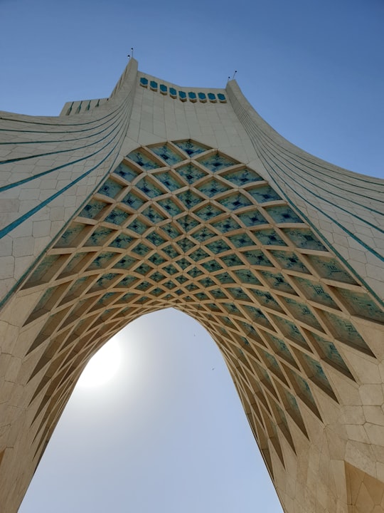 low angle photography of gray concrete building in Azadi Tower Iran