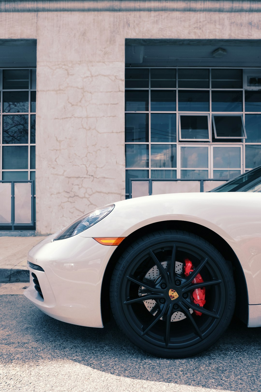 white car parked near building