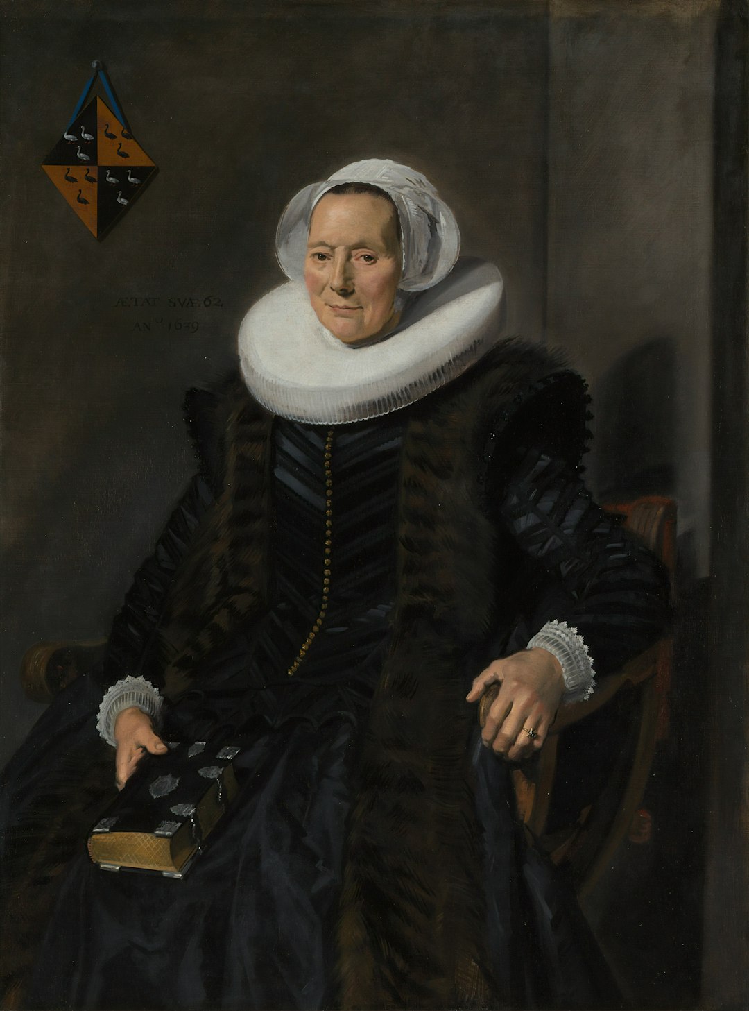 woman in black and white coat sitting on chair