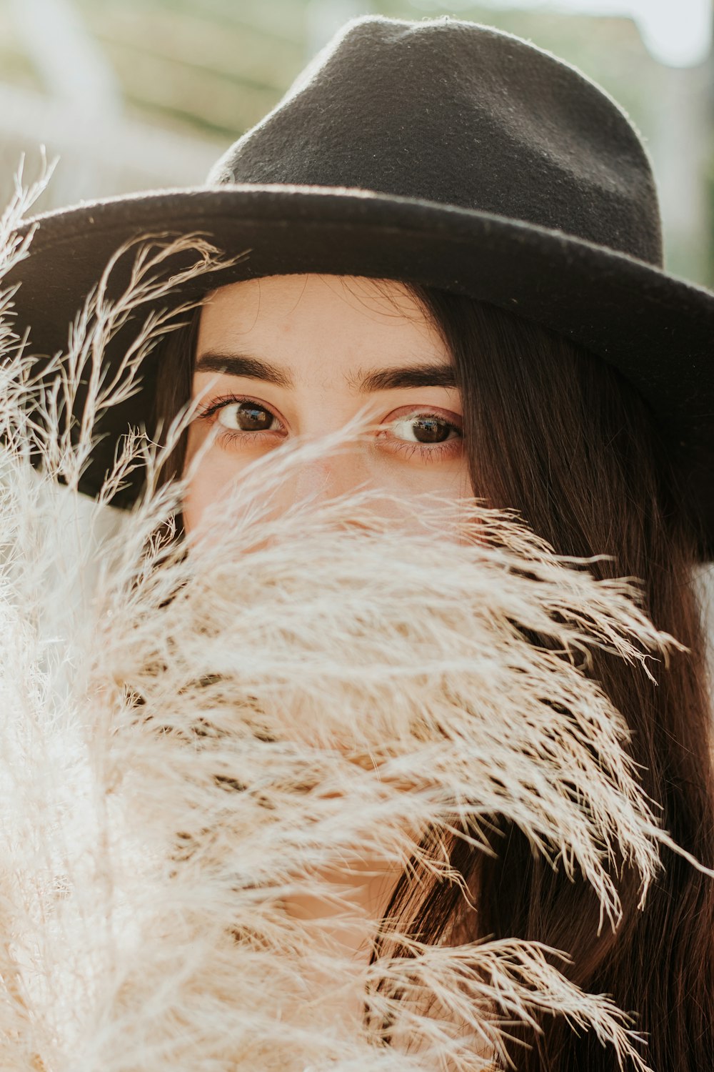 woman wearing black hat with white fur