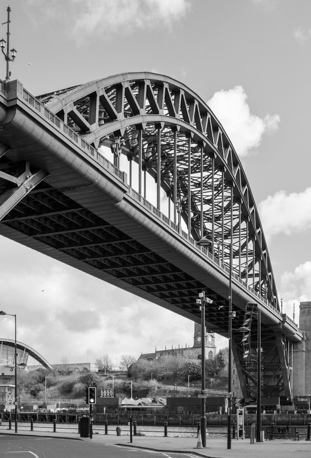 grayscale photo of metal bridge