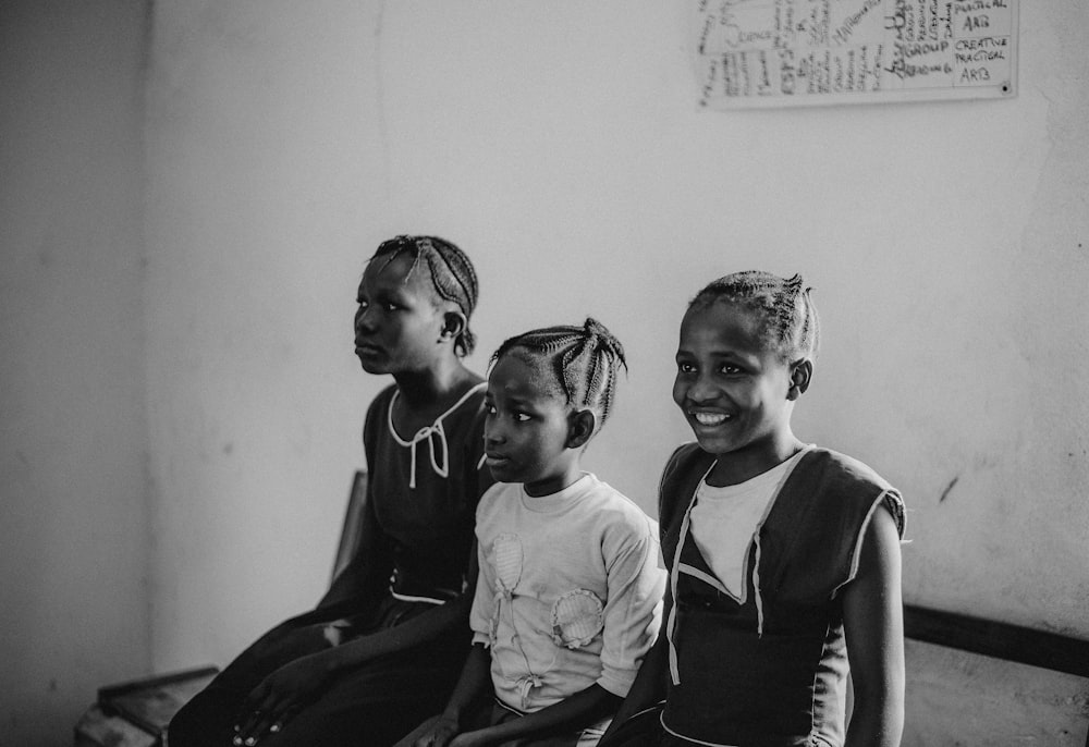 grayscale photo of 2 boys and 2 girls