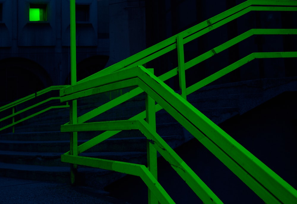 green and black metal staircase