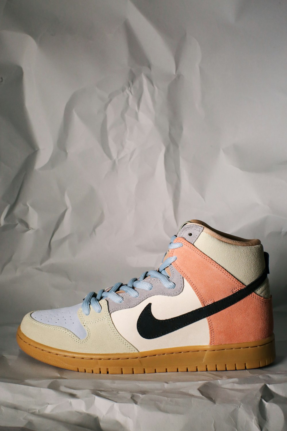 white and brown nike sneaker