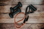 orange and black usb cable on brown wooden surface