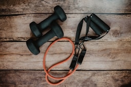 orange and black usb cable on brown wooden surface