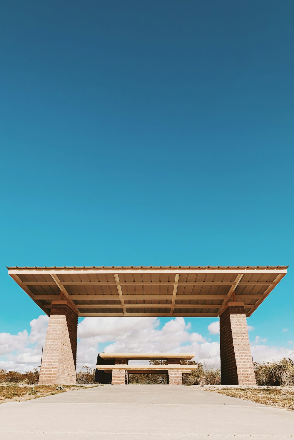 brown and white concrete building under blue sky during daytime