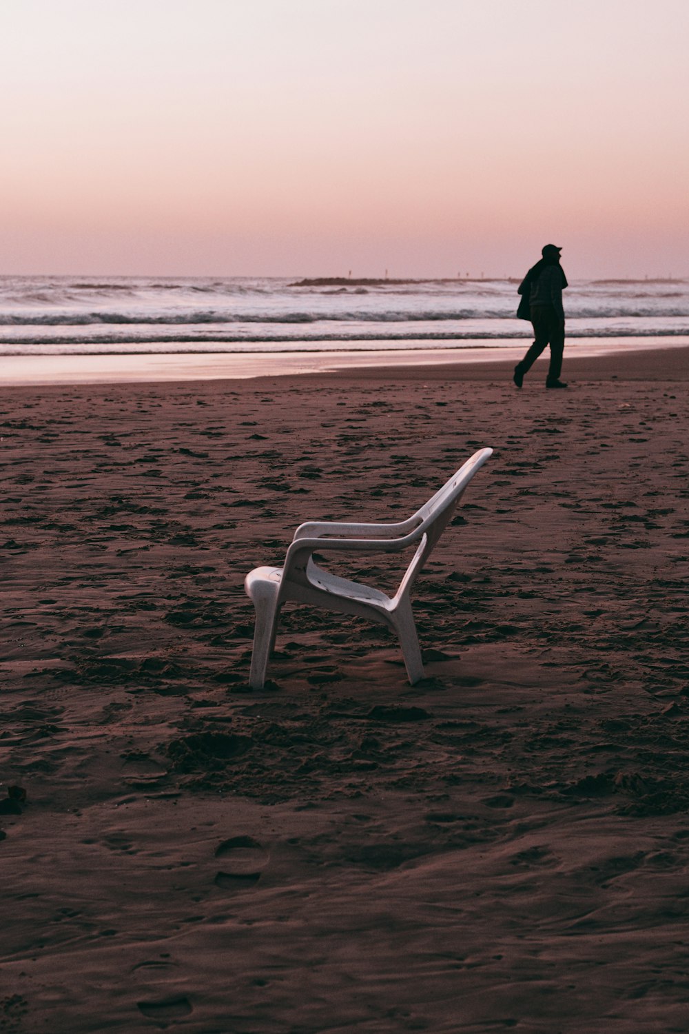 person walking on beach during daytime