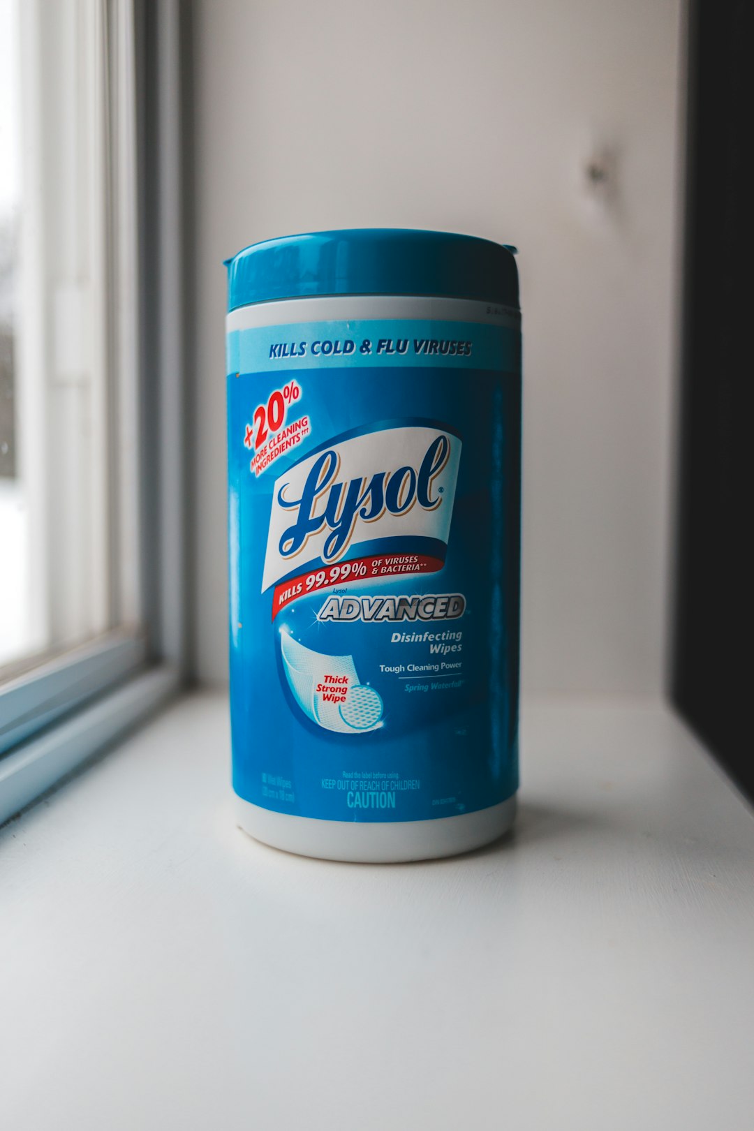 lysol disinfecting wipes container on white table