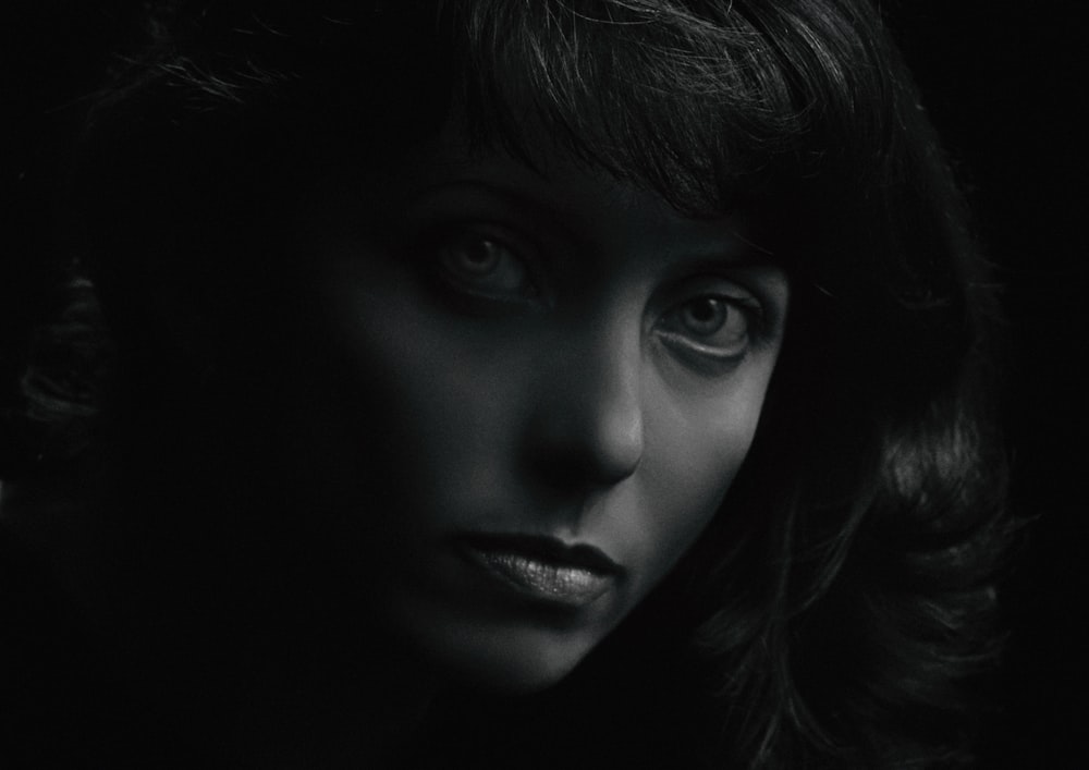 grayscale photo of womans face