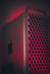 silver ipad on red textile