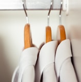 white and brown clothes hanger