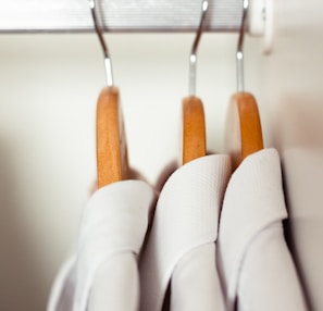 white and brown clothes hanger
