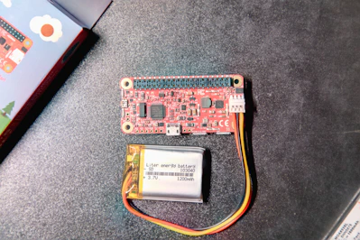 Close-up of a high-capacity lithium battery glowing softly on a workbench