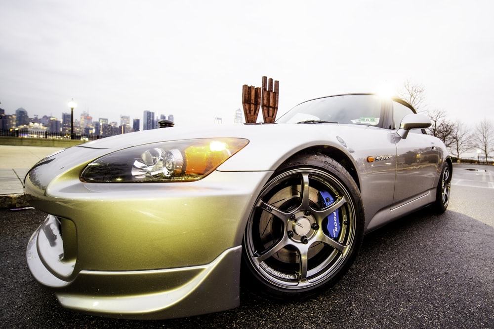 silver porsche 911 parked on parking lot during daytime