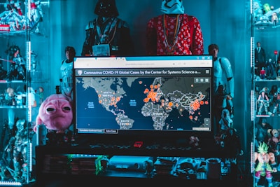 black flat screen tv turned on displaying man in black and red jacket