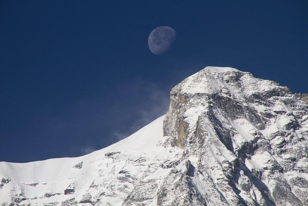 snow covered mountain under blue sky during daytime