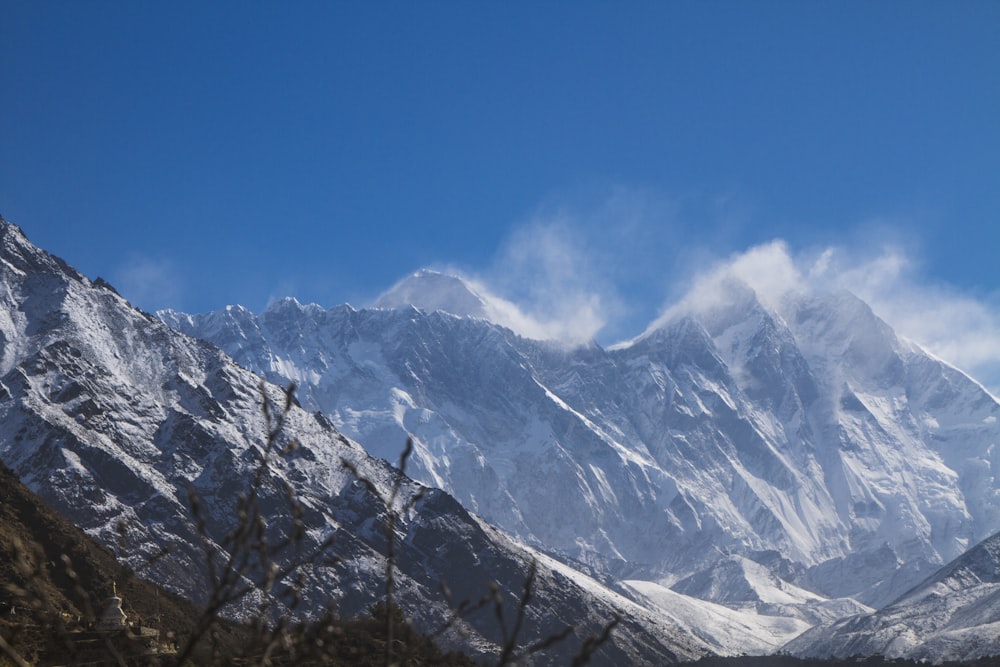 snow covered mountain under blue sky during daytime