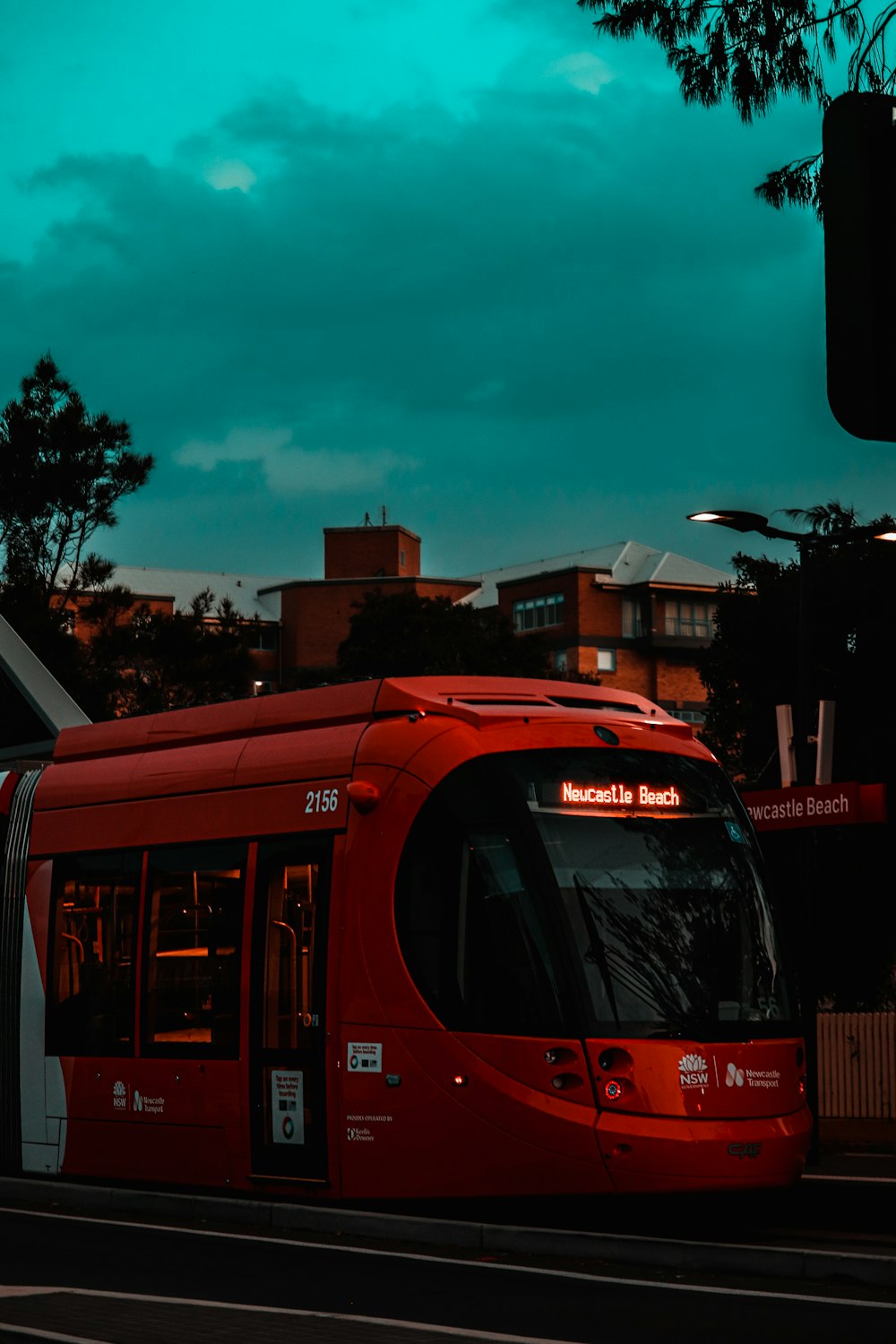 red double decker bus on road during daytime