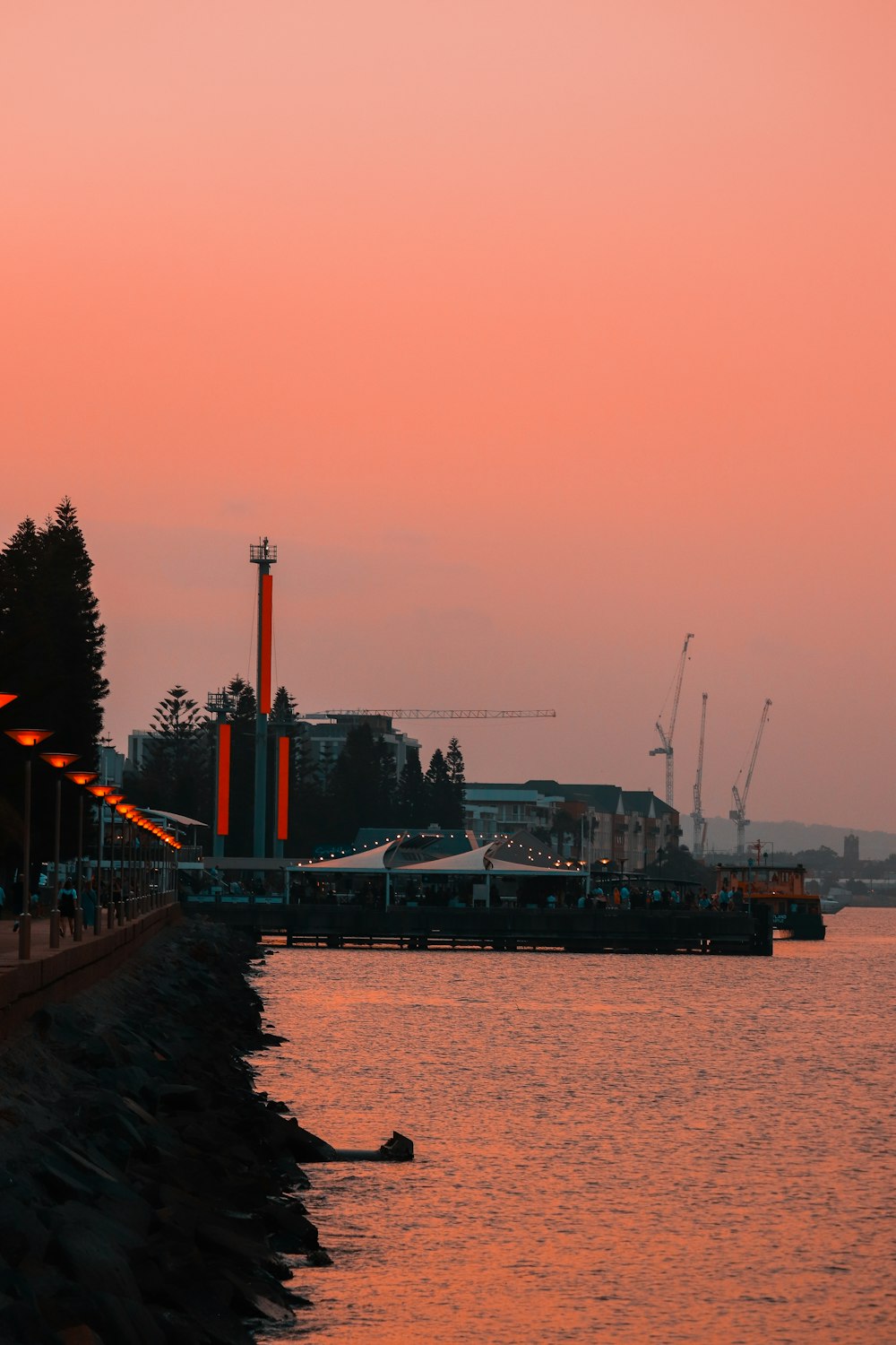 red and white bridge over water during daytime