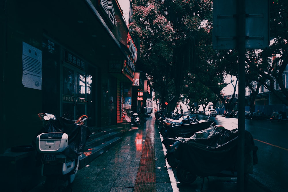 cars parked on sidewalk during daytime