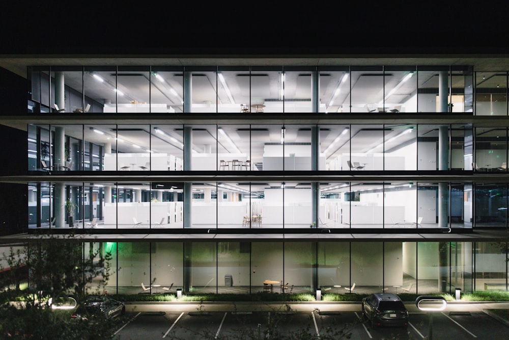 cars parked in front of building during night time