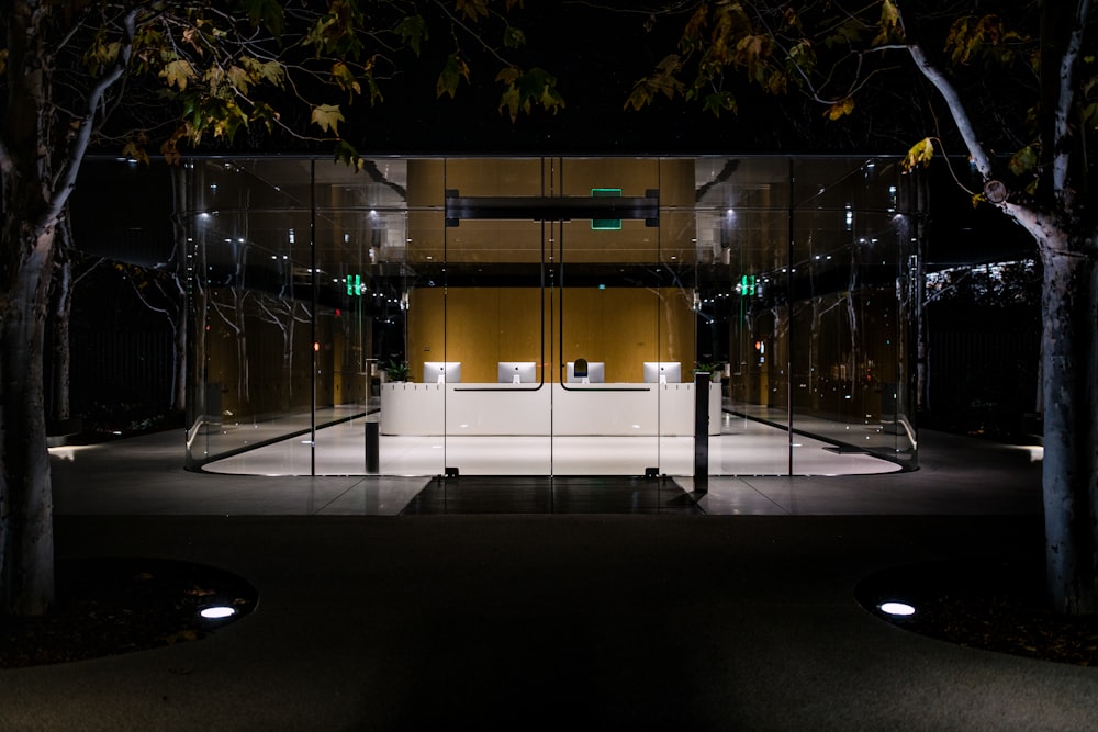 white and black building with glass walls