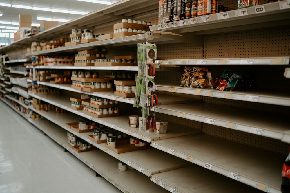 woman in white shirt standing on grocery store