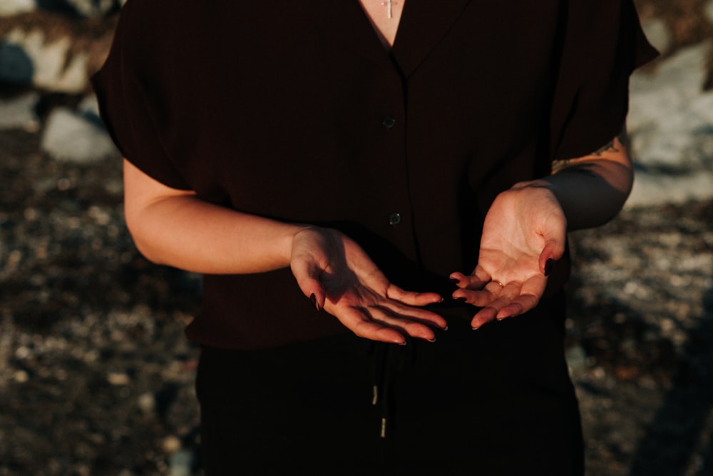 person in black button up shirt