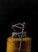 silver safety pin on yellow textile