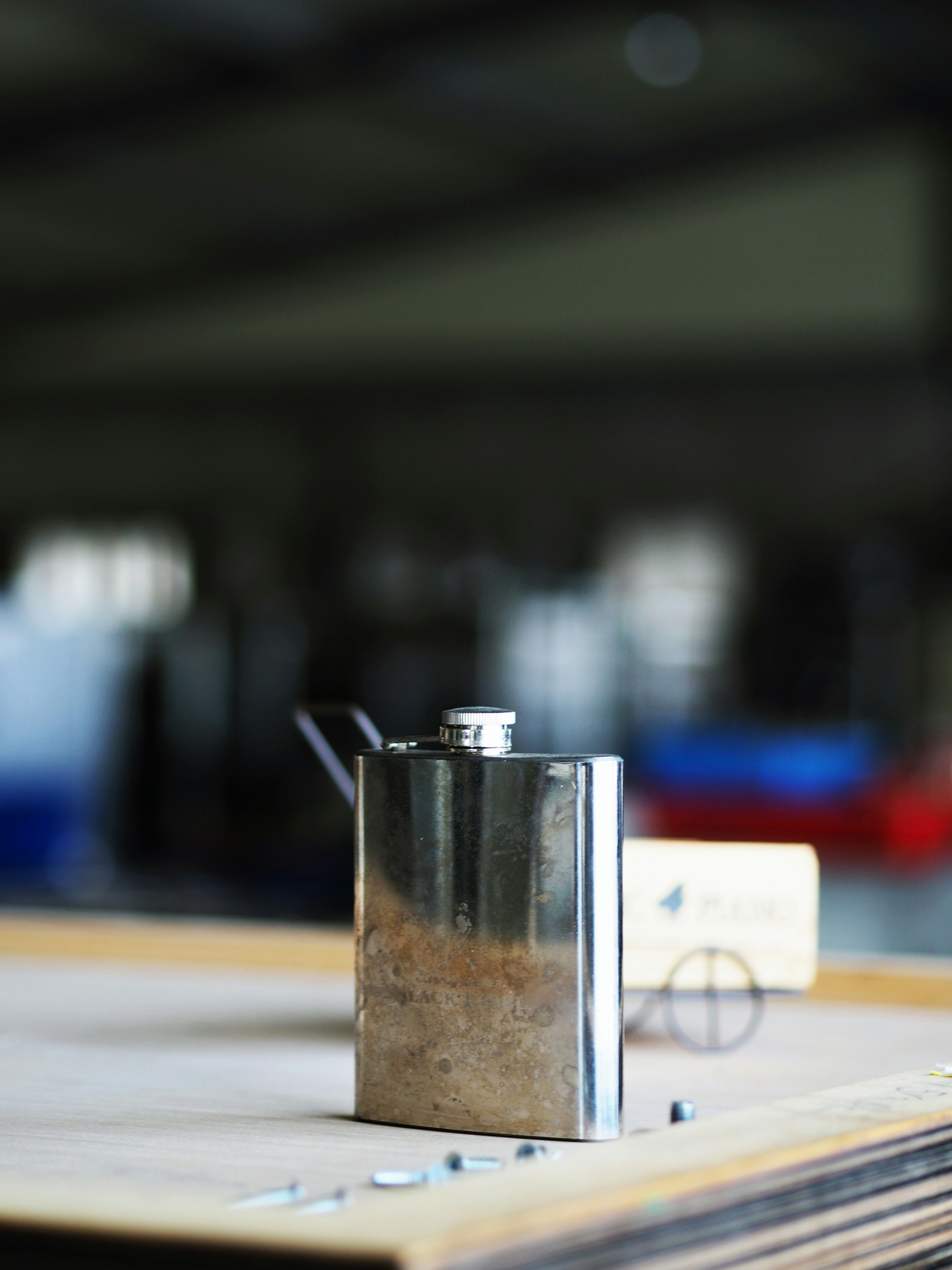 silver and black steel container on white table
