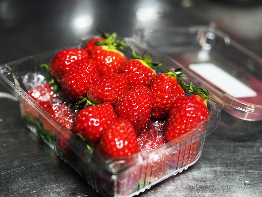 strawberries in clear plastic container