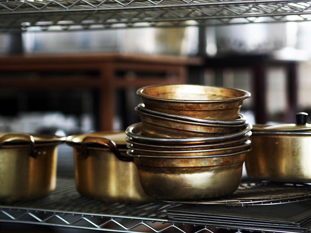 brown ceramic mug on stainless steel tray